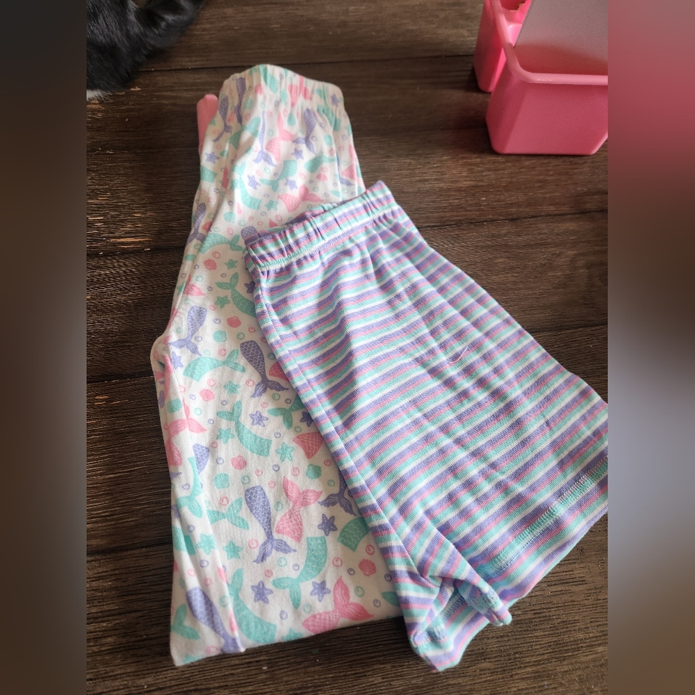 Size 10 multi colored pajama bottoms, pair of shorts and pants.